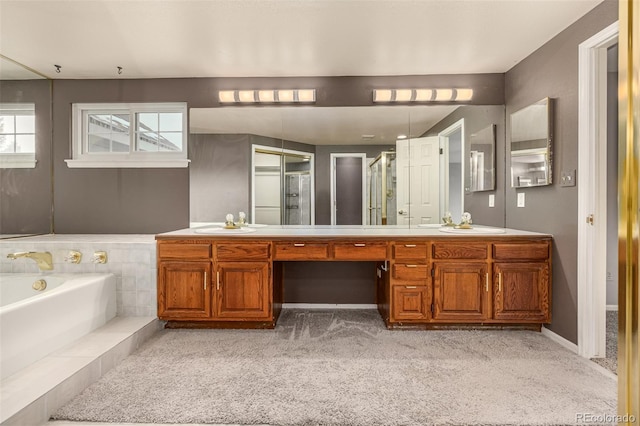 full bathroom featuring vanity, a garden tub, carpet flooring, and a stall shower