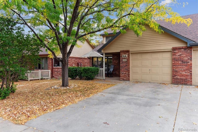 view of front of property featuring a garage and covered porch