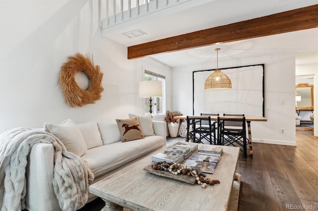 living room featuring dark wood-type flooring and beam ceiling