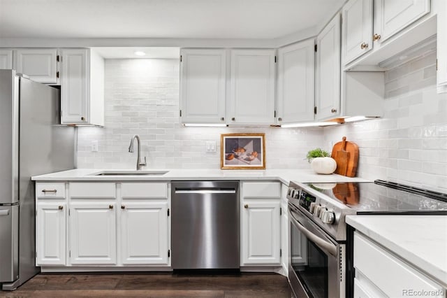 kitchen with stainless steel appliances and white cabinets