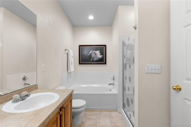 full bath with a garden tub, toilet, tile patterned flooring, vanity, and a shower stall