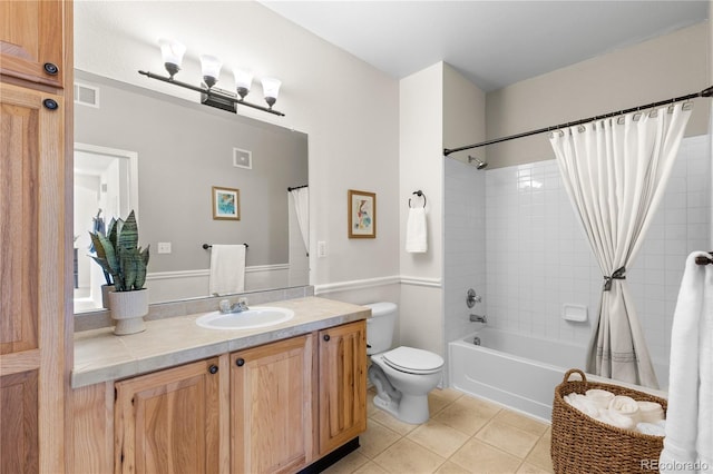 bathroom featuring visible vents, shower / bathtub combination with curtain, toilet, vanity, and tile patterned floors