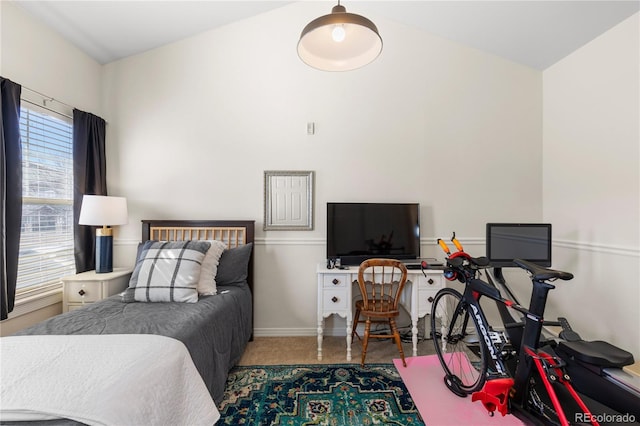 bedroom with baseboards and carpet flooring