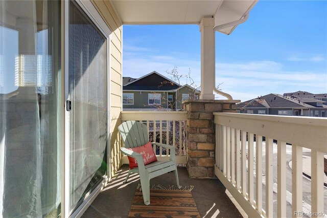 balcony featuring a residential view