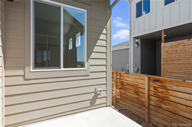 6129 Zebulon Pl, Timnath, CO 80547 - view of side of home featuring fence and board and batten siding