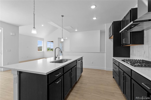 6129 Zebulon Pl, Timnath, CO 80547 - kitchen with a sink, dark cabinets, wall chimney exhaust hood, light countertops, and vaulted ceiling