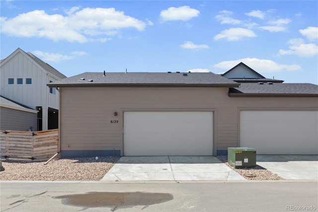 6129 Zebulon Pl, Timnath, CO 80547 - view of front facade with driveway, a shingled roof, and fence