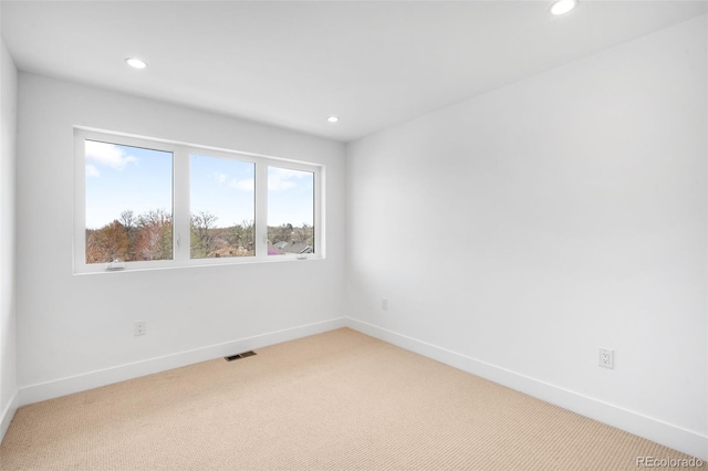 2926 S Cherokee St, Englewood, CO 80110 - empty room with light colored carpet and recessed lighting