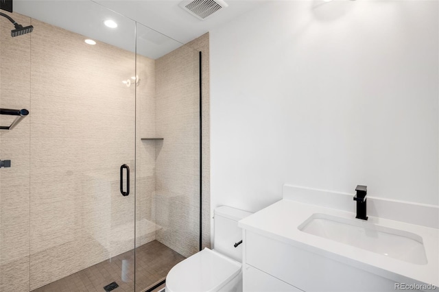 2926 S Cherokee St, Englewood, CO 80110 - bathroom with a shower stall, recessed lighting, and vanity