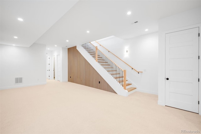 2926 S Cherokee St, Englewood, CO 80110 - basement with light colored carpet, recessed lighting, and stairs