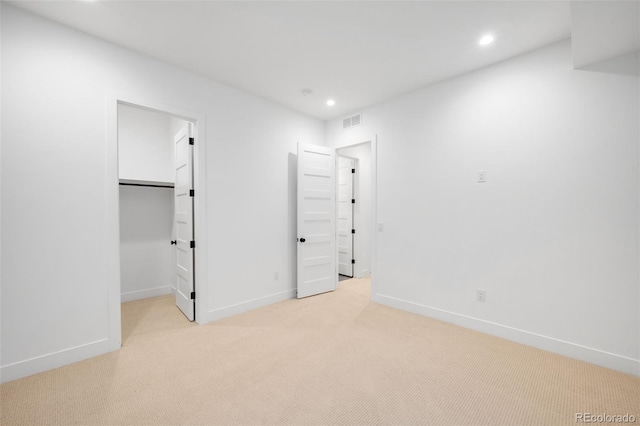 2926 S Cherokee St, Englewood, CO 80110 - unfurnished bedroom with light carpet, recessed lighting, and a spacious closet