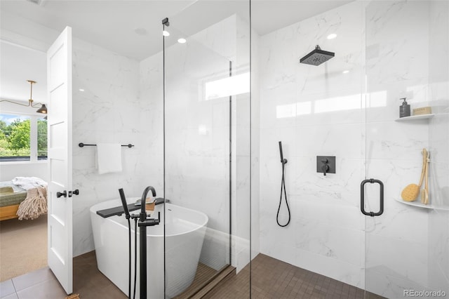 2926 S Cherokee St, Englewood, CO 80110 - ensuite bathroom featuring a freestanding tub and a marble finish shower