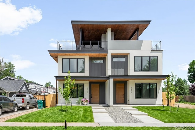 2926 S Cherokee St, Englewood, CO 80110 - modern home featuring a balcony and stucco siding
