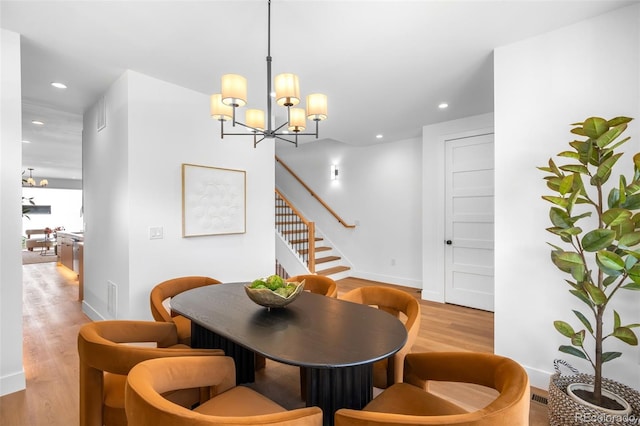 2926 S Cherokee St, Englewood, CO 80110 - dining space featuring light wood-style flooring, recessed lighting, a chandelier, and stairway
