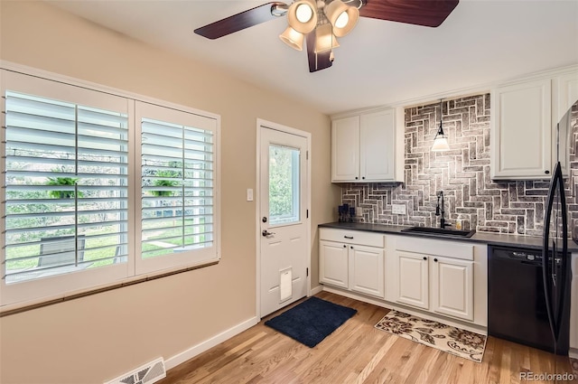 kitchen with dishwasher, a sink, dark countertops, ceiling fan, and tasteful backsplash