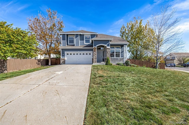 view of front property with a garage and a front lawn