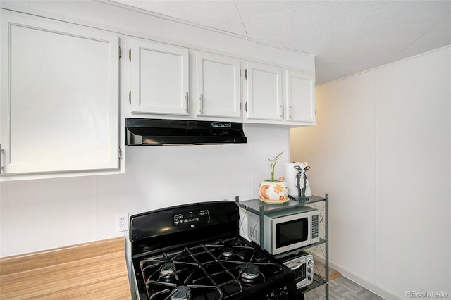 kitchen with white cabinets and black range with gas cooktop