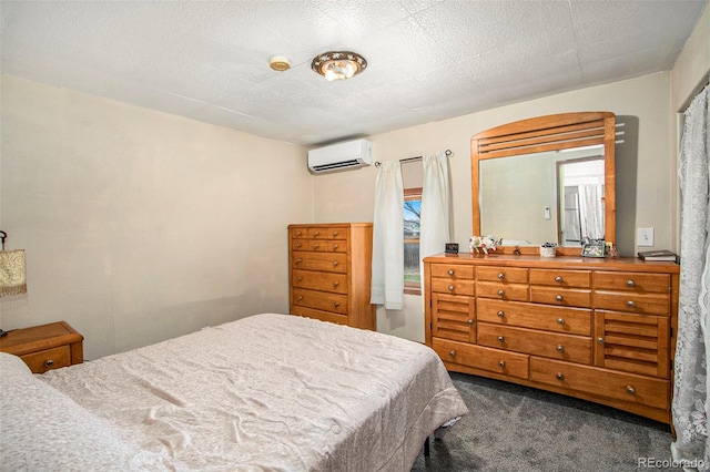 carpeted bedroom featuring a textured ceiling and an AC wall unit