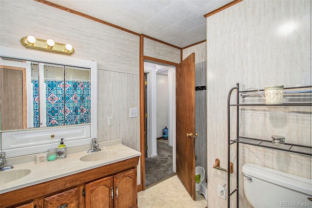 bathroom featuring toilet and vanity