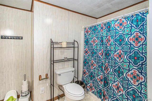 bathroom with toilet and crown molding