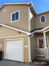 view of home's exterior with a garage and driveway