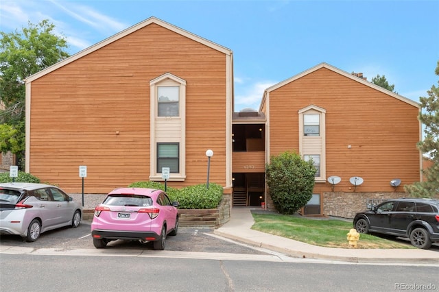4283 S Salida Way Unit 12, Aurora, CO 80013 - view of building exterior featuring uncovered parking