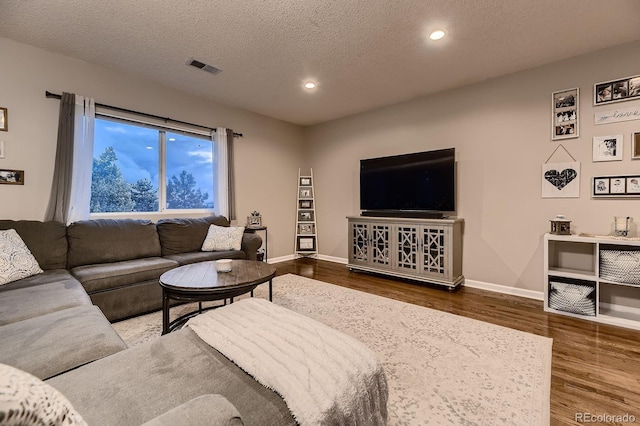 1100 E Harvey St, Castle Rock, CO 80108 - living room with wood finished floors, recessed lighting, and a textured ceiling