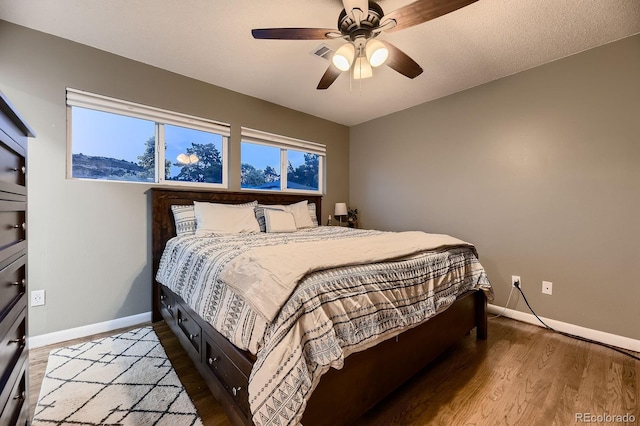 1100 E Harvey St, Castle Rock, CO 80108 - bedroom with wood finished floors and a ceiling fan