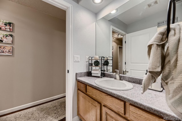 1100 E Harvey St, Castle Rock, CO 80108 - bathroom with vanity and baseboards