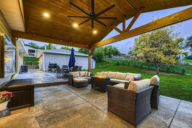 1100 E Harvey St, Castle Rock, CO 80108 - fenced backyard featuring an outdoor living space with a fire pit, a patio area, outdoor dining space, ceiling fan, and a storage unit