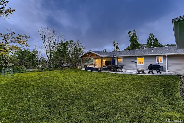 1100 E Harvey St, Castle Rock, CO 80108 - rear view of house featuring a patio area and a lawn