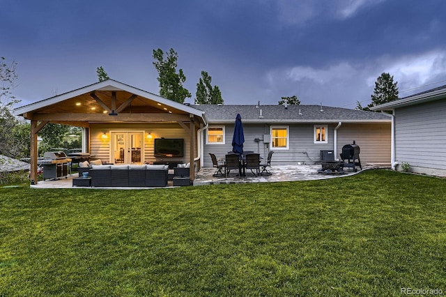 1100 E Harvey St, Castle Rock, CO 80108 - back of house featuring outdoor lounge area, a patio area, a yard, and roof with shingles