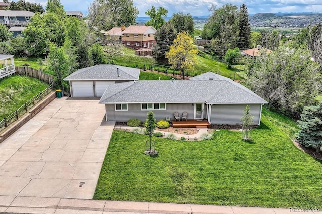 1100 E Harvey St, Castle Rock, CO 80108 - view of front of home with a deck, an outbuilding, and a garage