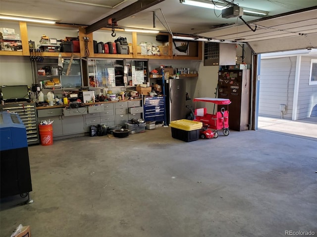 1100 E Harvey St, Castle Rock, CO 80108 - garage with a workshop area and a garage door opener