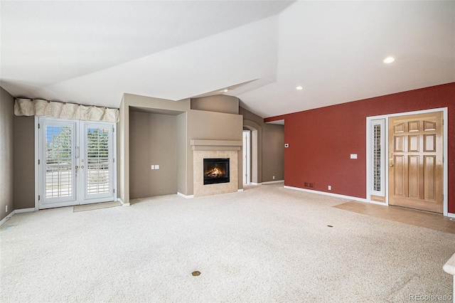13806 E Chenango Dr, Aurora, CO 80015 - unfurnished living room with vaulted ceiling, carpet flooring, a fireplace, baseboards, and recessed lighting