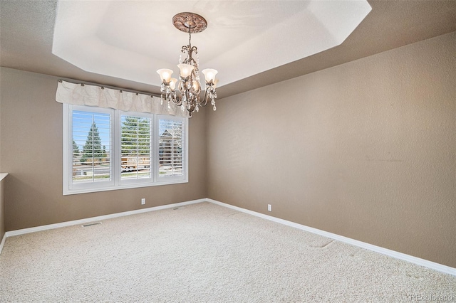 13806 E Chenango Dr, Aurora, CO 80015 - carpeted empty room featuring a chandelier and a tray ceiling
