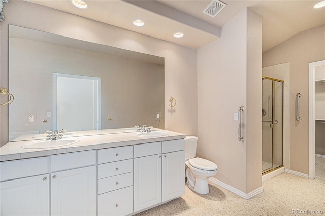 13806 E Chenango Dr, Aurora, CO 80015 - full bath featuring a shower stall, double vanity, recessed lighting, and a walk in closet