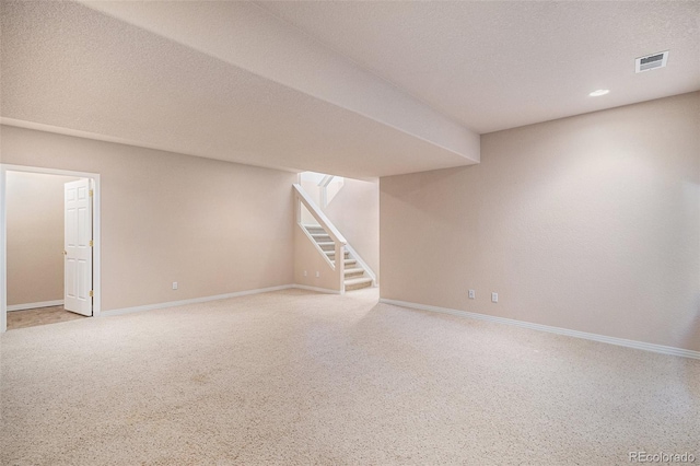 13806 E Chenango Dr, Aurora, CO 80015 - finished below grade area with stairway, carpet, and a textured ceiling