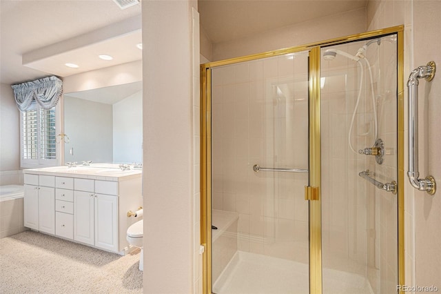13806 E Chenango Dr, Aurora, CO 80015 - bathroom featuring double vanity, a shower stall, recessed lighting, and a bathtub