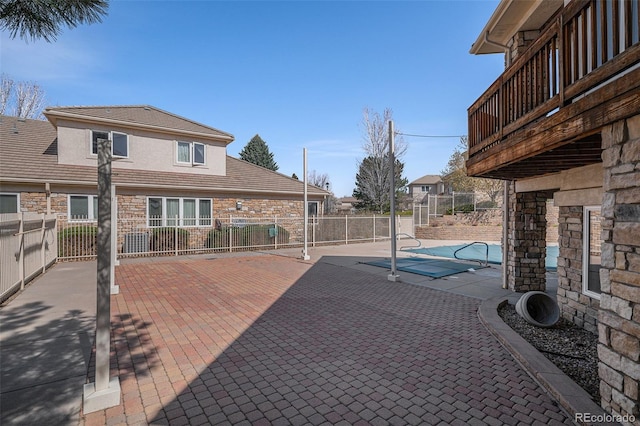 13806 E Chenango Dr, Aurora, CO 80015 - view of swimming pool with a patio