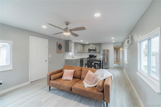 14701 E Colfax Ave Unit A5, Aurora, CO 80011 - living area with light wood-style flooring, baseboards, ceiling fan, and recessed lighting