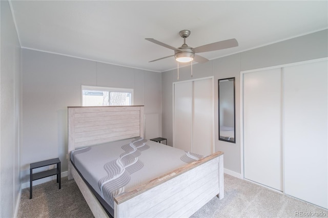 14701 E Colfax Ave Unit A5, Aurora, CO 80011 - bedroom featuring multiple closets, carpet flooring, a ceiling fan, and baseboards
