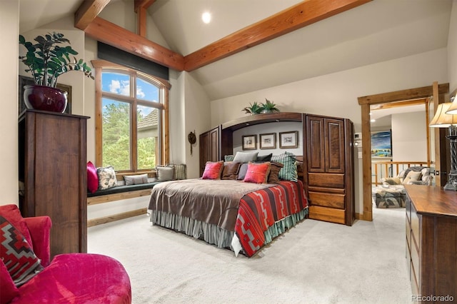 carpeted bedroom with lofted ceiling with beams