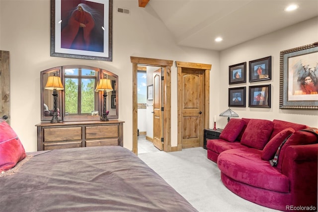 carpeted bedroom with high vaulted ceiling and beamed ceiling