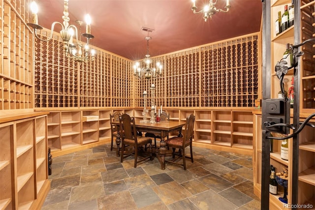 wine room with an inviting chandelier