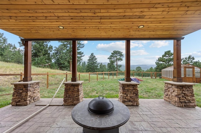 view of patio / terrace featuring a shed