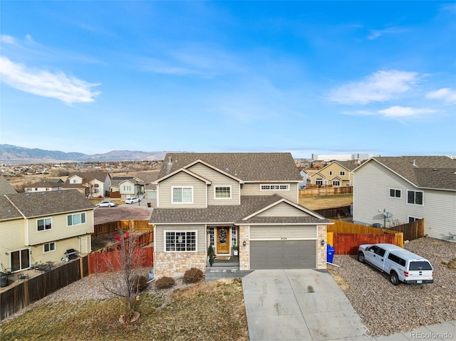 view of front of house with a mountain view and a garage