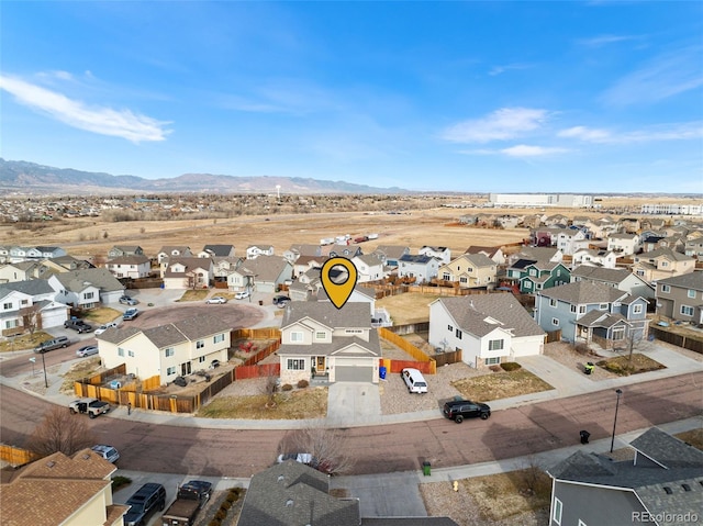 drone / aerial view featuring a mountain view