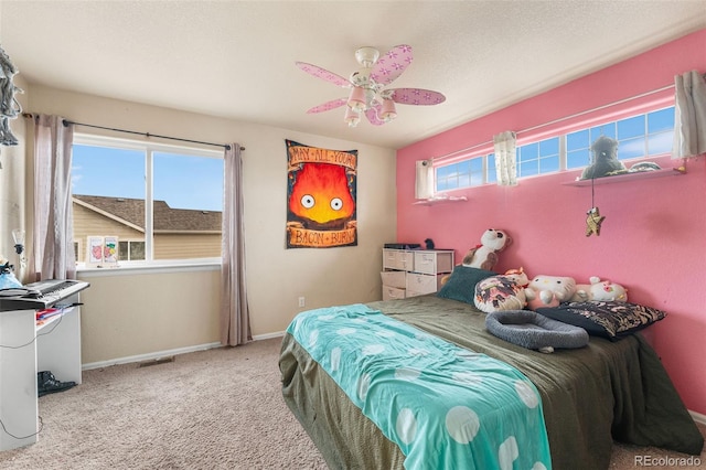 bedroom featuring ceiling fan and light colored carpet