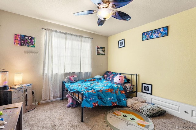 bedroom with ceiling fan and light colored carpet